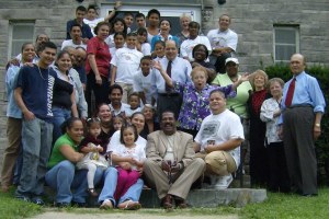 Youth and other members from Iglesia Hermandad Cristiana pose with Associate Regional Minister Carolyn Reed following the celebration on August 23.
